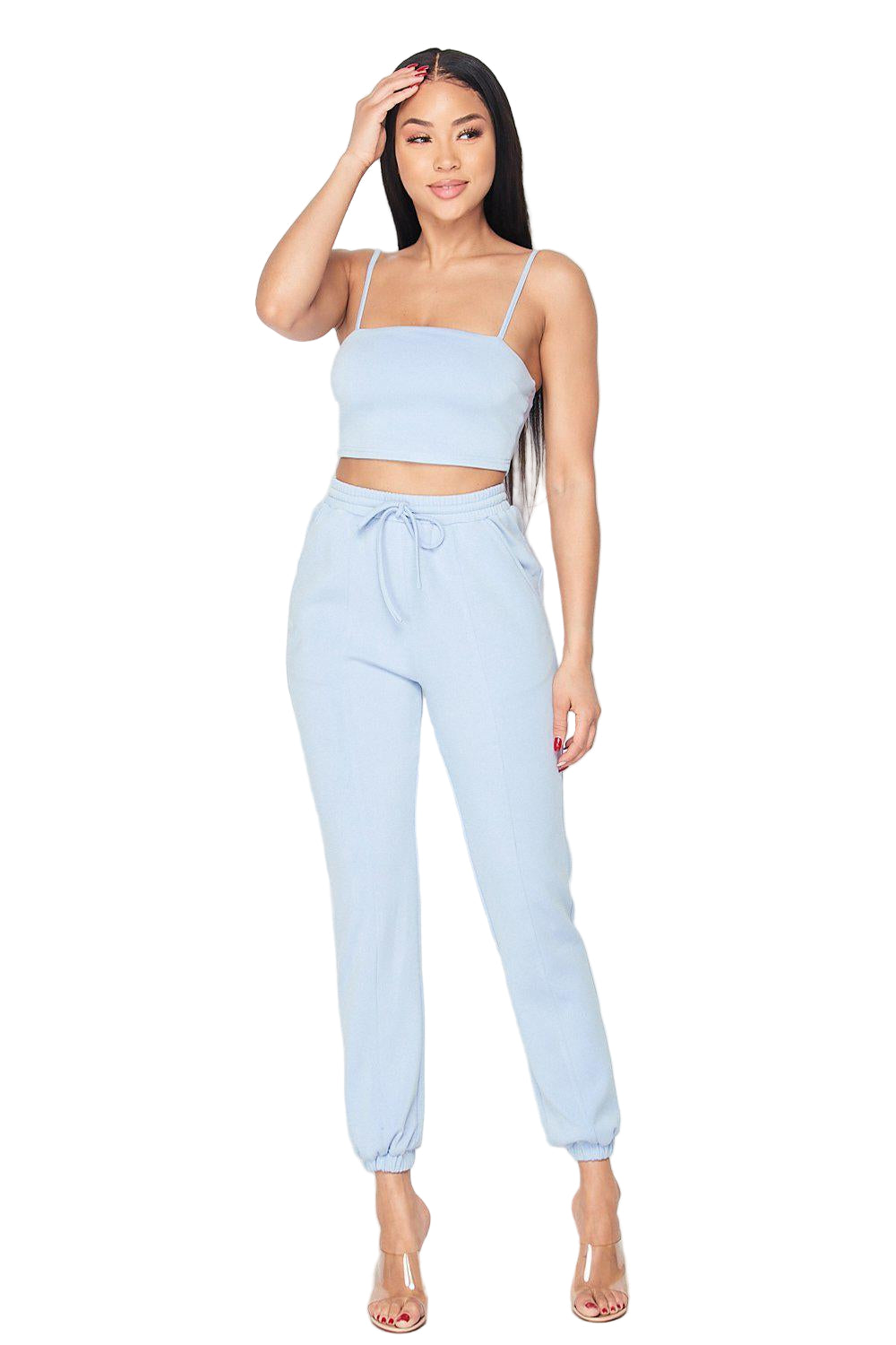 Woman wearing Keep It Cute two-piece set in light blue, featuring a fitted top and drawstring pants, perfect for stylish comfort.