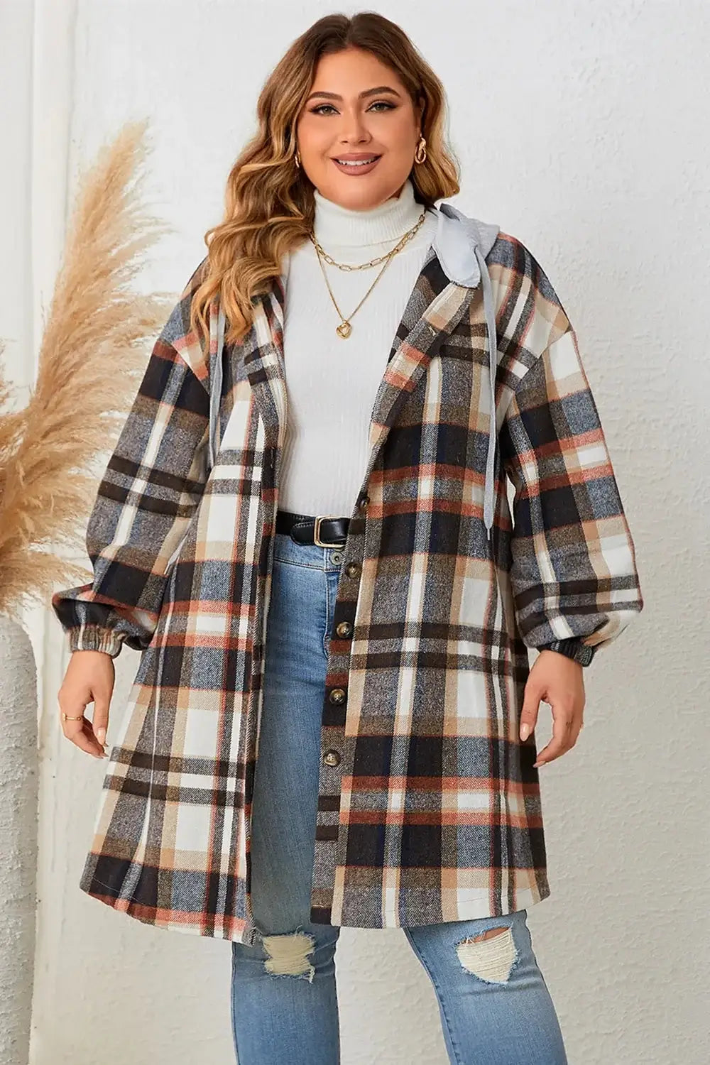 Plus size woman wearing a stylish plaid coat from the Curvy Coats collection for curvy women.