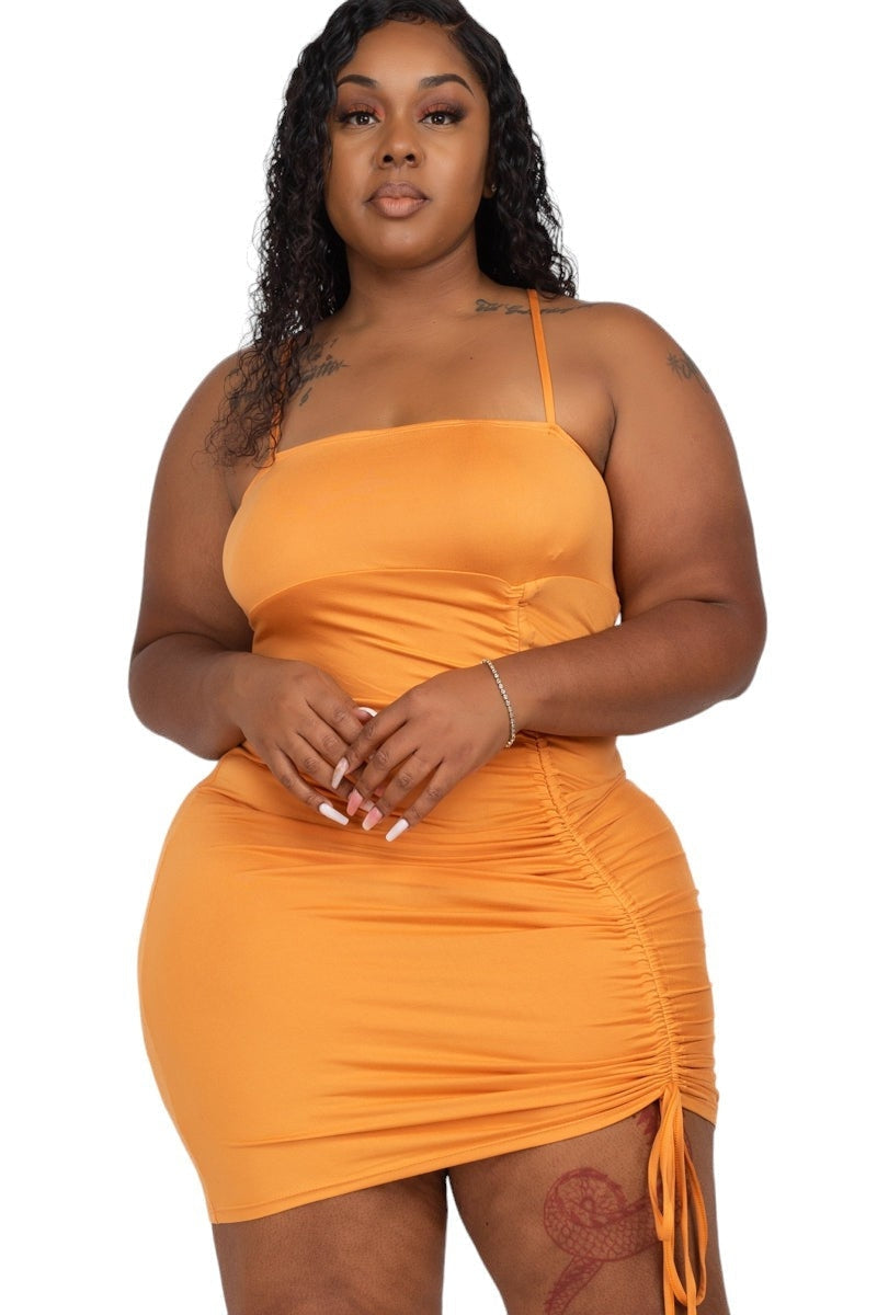 Orange curvy mini dress showcasing confident and stylish fashion for women.