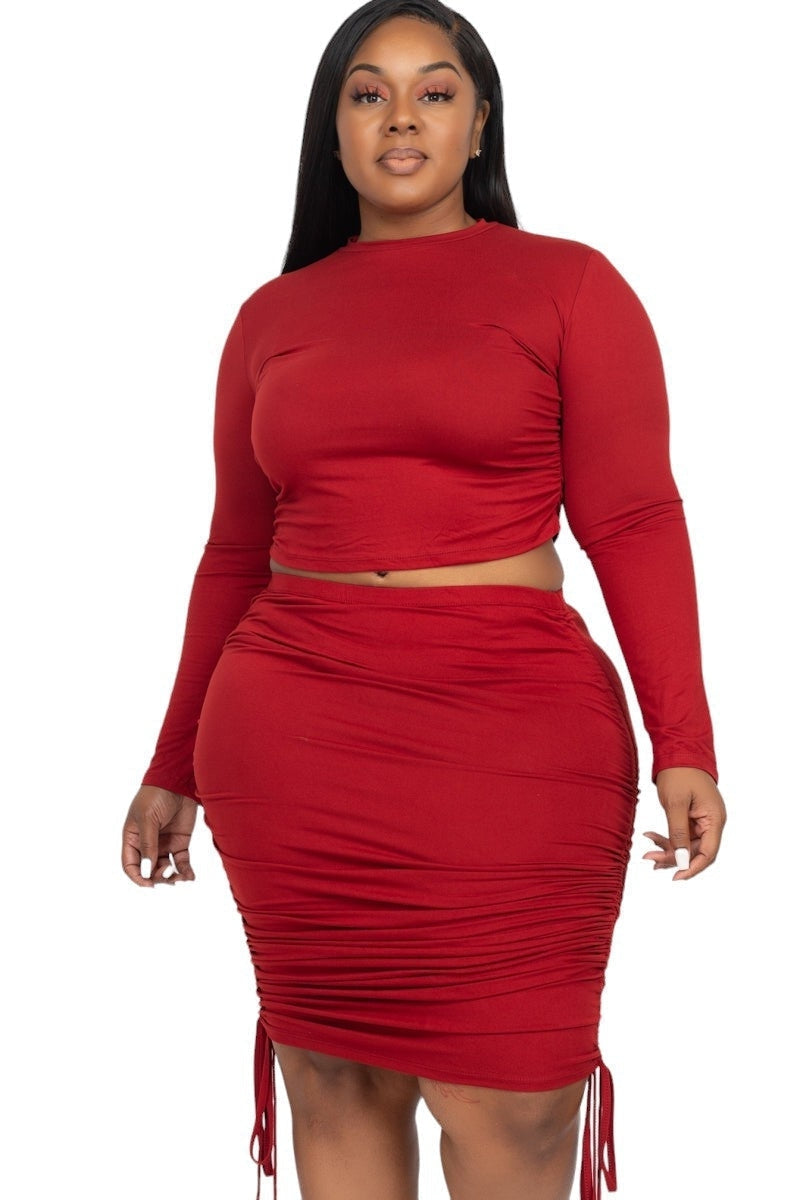 Red plus size skirt set with long sleeves, perfect for curvy women seeking chic and comfortable fashion for any occasion.