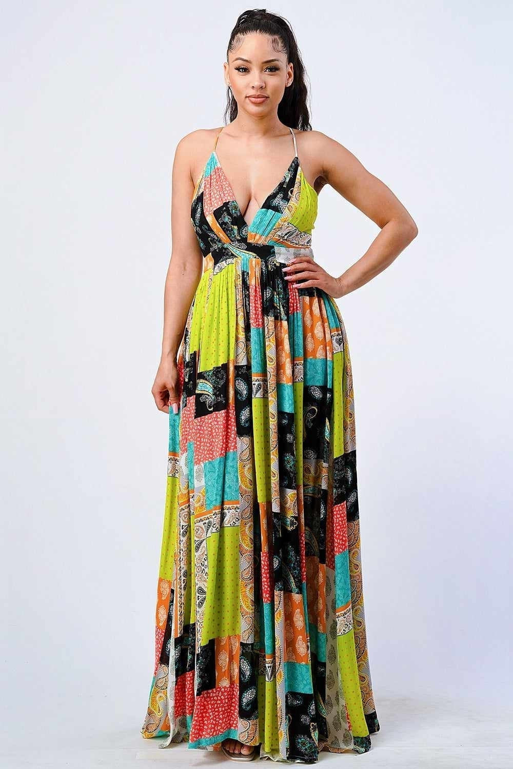 Elegant bohemian maxi dress with colorful patchwork design, perfect for a stylish and confident fashion statement.