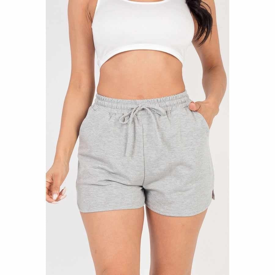 Grey women’s summer shorts with pockets, featuring a comfortable elastic waistband, perfect for casual daytime wear.