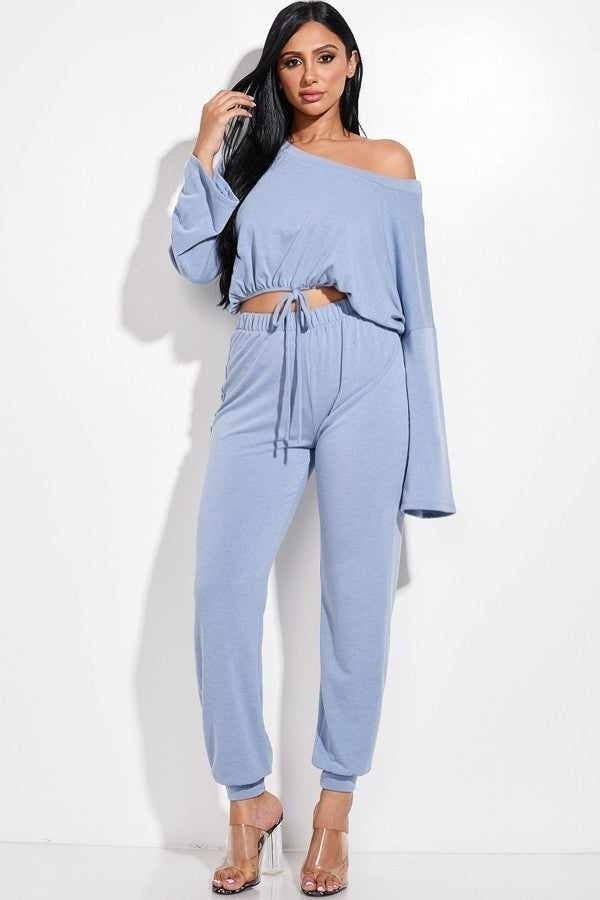 Trendy light blue women's two-piece lounge set featuring an off-shoulder top and drawstring waist pants, perfect for casual comfort.