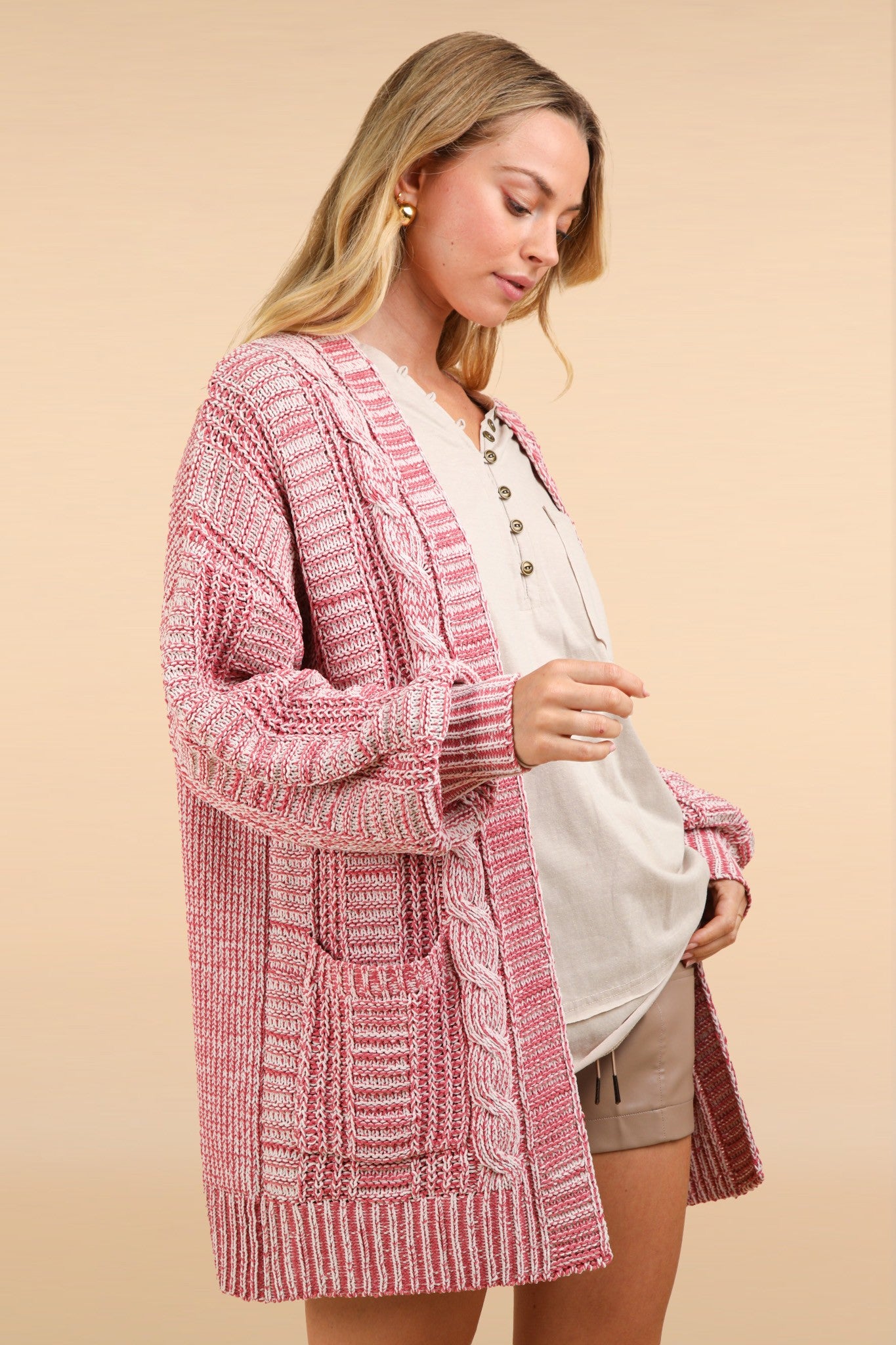 Woman wearing a pink VERY J cable knit open front cardigan with tweed design, perfect for spring, fall, and winter.