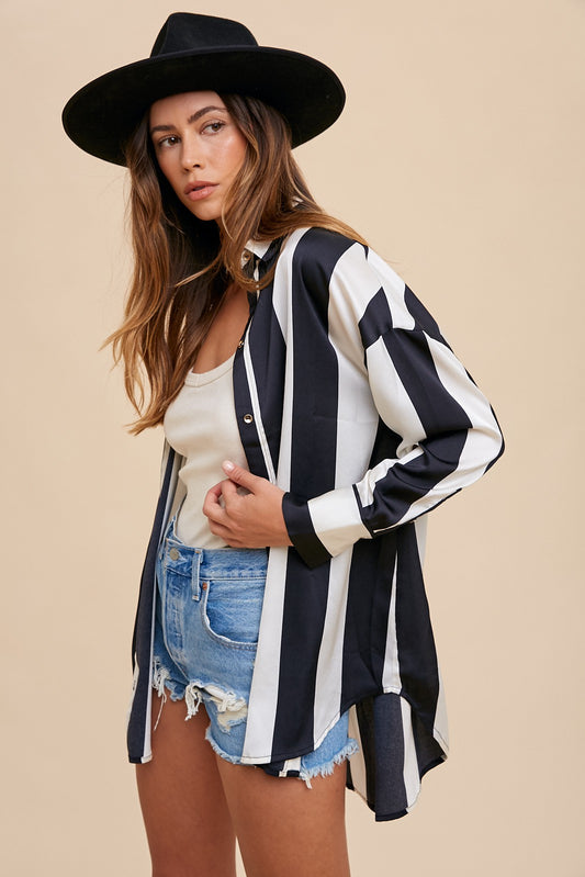 Woman in a black hat wearing a Fall Striped Dropped Shoulder Button Up Shirt with denim shorts, styled for autumn fashion.