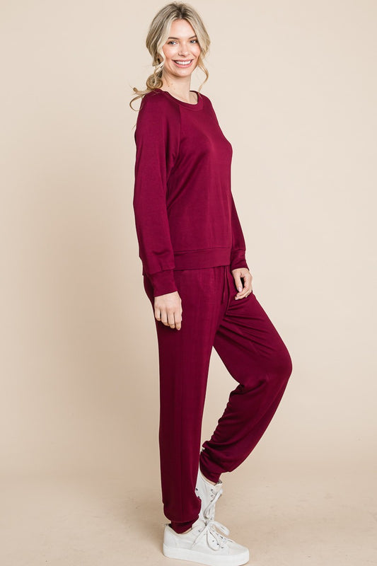 Burgundy round neck raglan sleeve top and pants lounge set, two-piece, basic style, slightly stretchy, polyester-rayon-spandex blend.