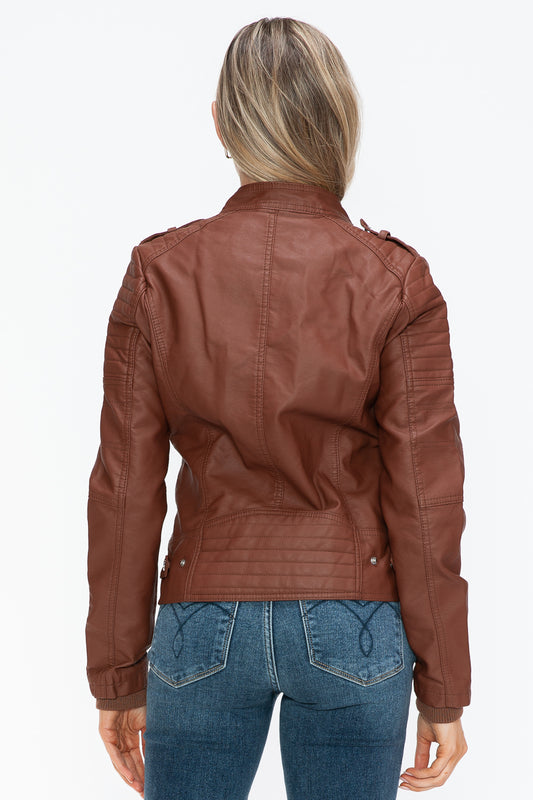 Woman wearing Brandy PU leather biker jacket with side zip pockets, back view, highlighting the stylish design and fit.