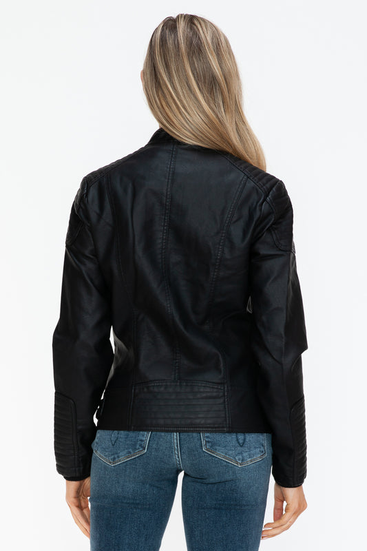 Woman wearing a Snobbish Faux Leather Biker Jacket with side zip pockets, featuring basic style and normal thickness, back view.