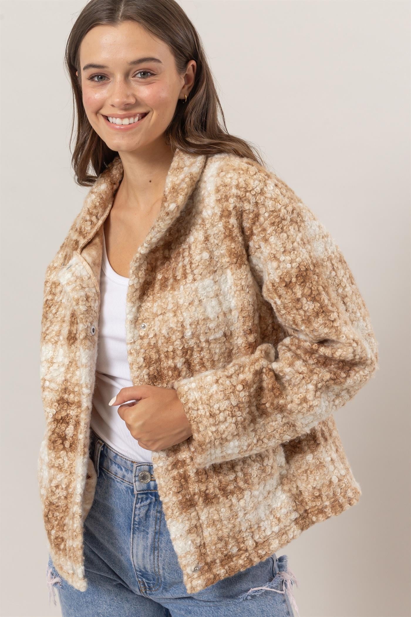 Woman wearing taupe plaid collared neck boucle jacket with pockets made of 100% polyester, casual and stylish outerwear.