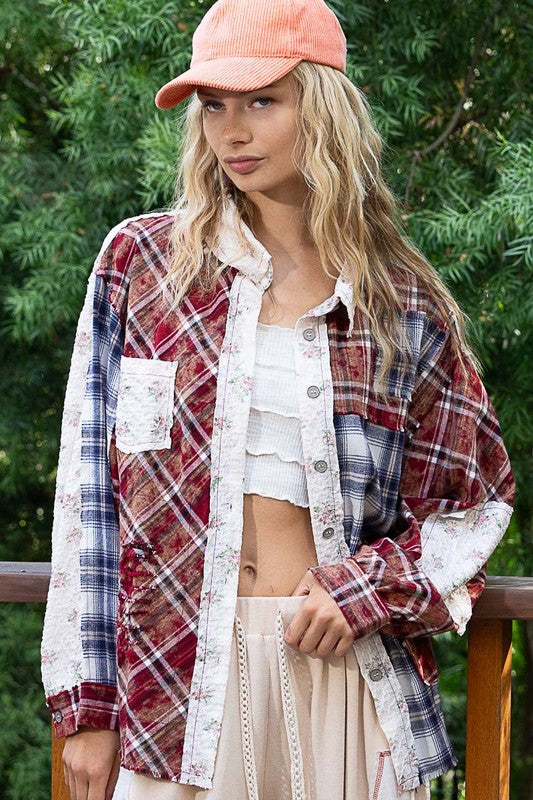 Woman wearing a Burgundy Patchwork Plaid Button Up Shirt with raw hem and exposed seam, styled over a white top.