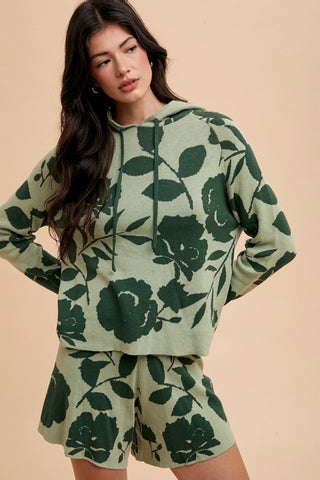 Flower pattern drawstring hooded top and shorts set in green, featuring ribbed design and slightly stretchy material.