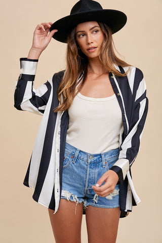 Woman wearing Fall Striped Dropped Shoulder Button Up Shirt with denim shorts and black hat, showcasing casual chic fashion.