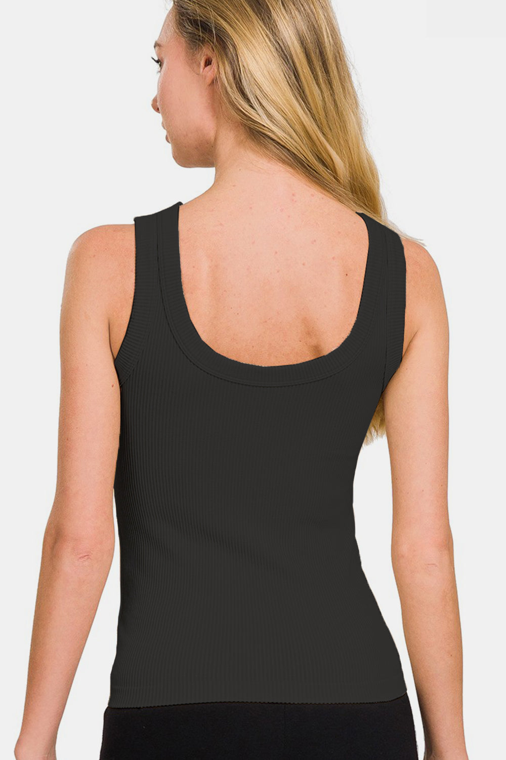 Woman wearing 2 way neckline washed ribbed tank, featuring basic style and moderate stretch in black nylon and spandex fabric.