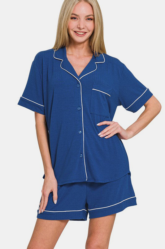 Navy button-down short sleeve lounge set with pocketed top and shorts in polyester-rayon fabric.