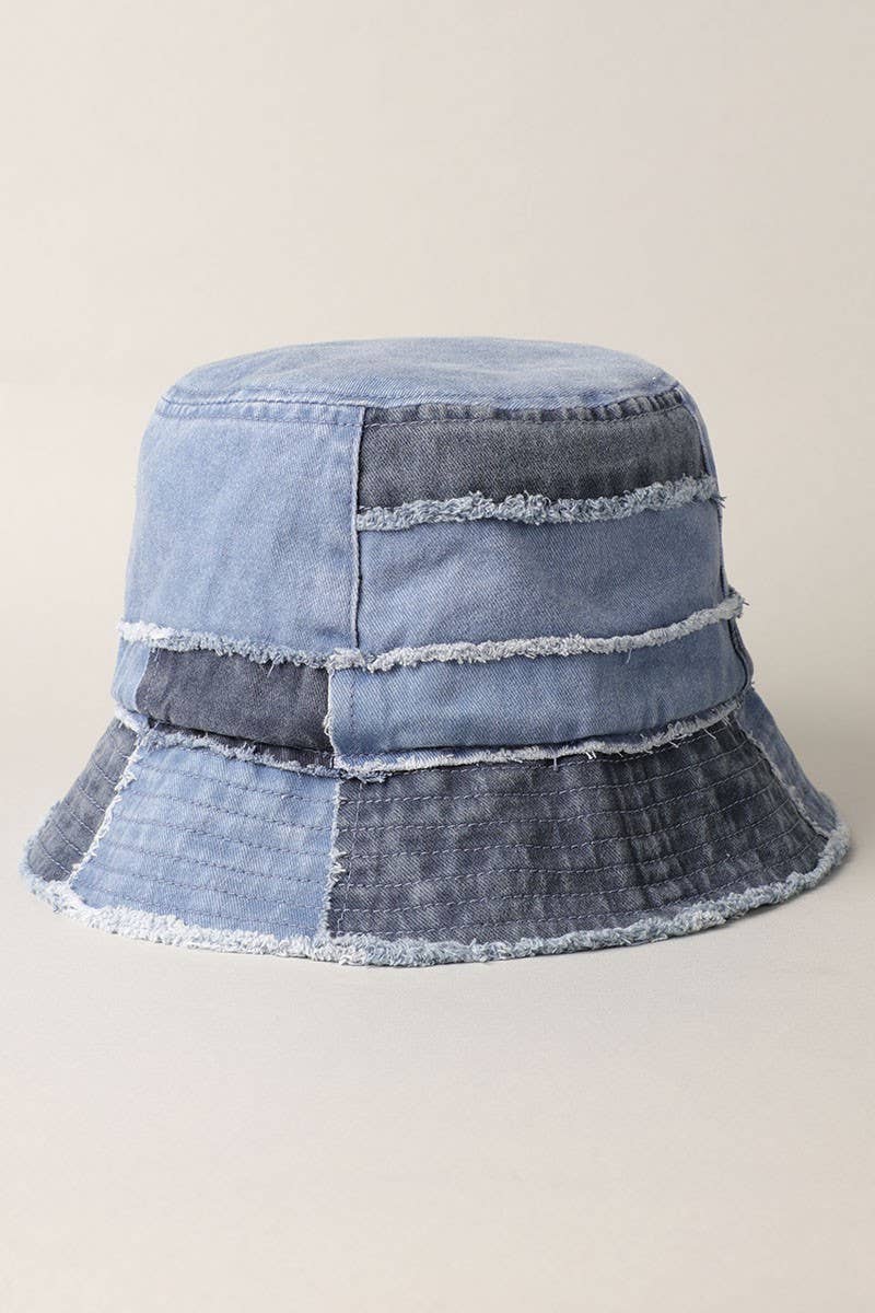 Multicolor frayed patchwork canvas denim bucket hat with narrow brim, made from 100% cotton for a stylish, worn-in look.