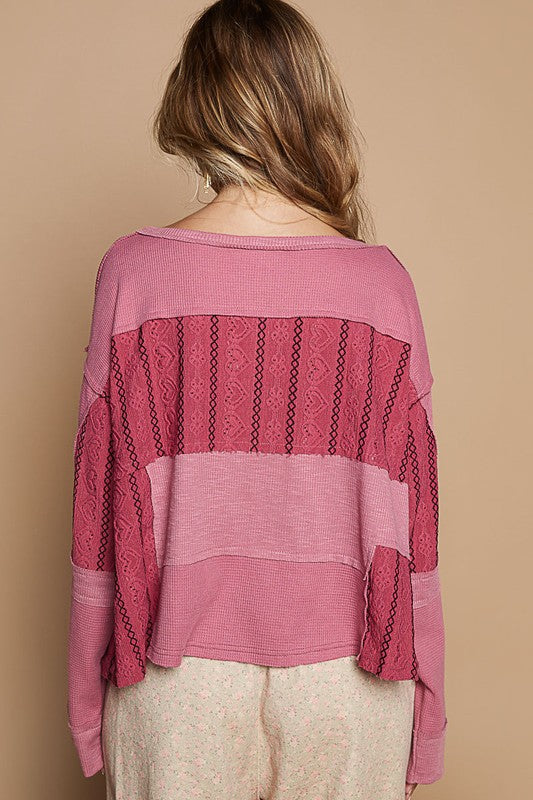 Back view of Cerise Half Button Color Block Drop Shoulder Knit Top with waffle-knit texture and eyelet details.