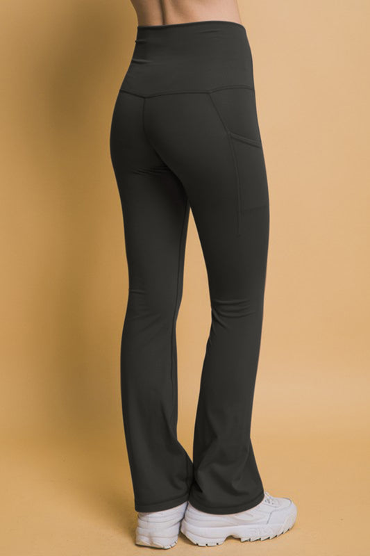 Black high waist flare active leggings with side pockets, stretchy polyester-spandex blend, perfect for workouts.