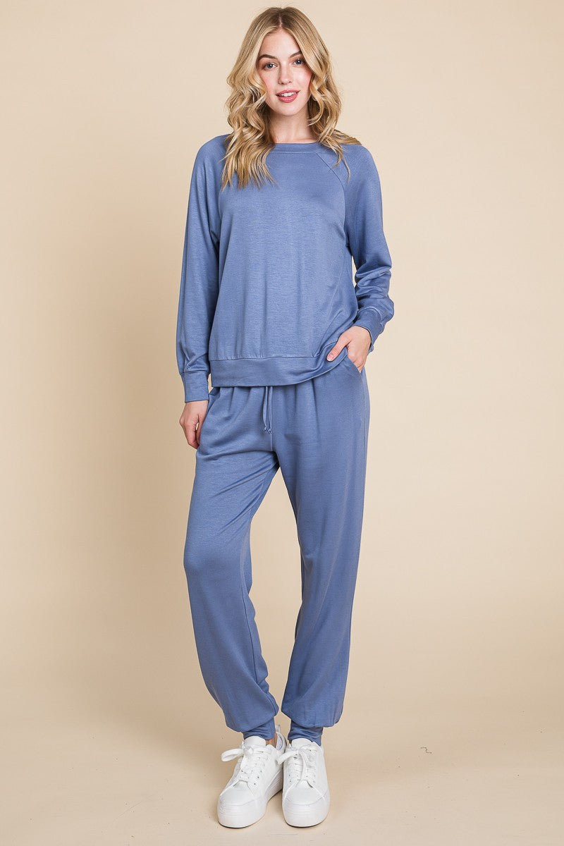 Powder blue round neck raglan sleeve top and pants lounge set with basic style and slight stretch fabric.