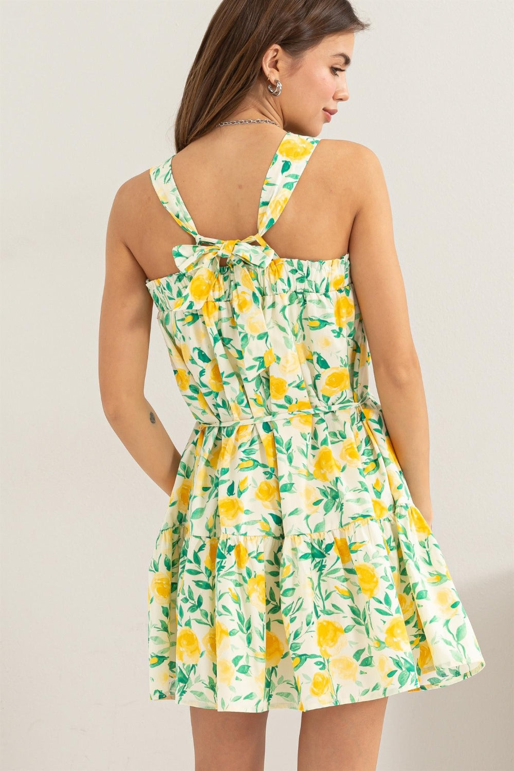 Yellow floral tie shoulder mini dress, tied and ruched style in 100% cotton, perfect for a fresh summer look.