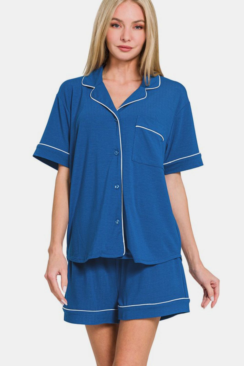 Classic blue button down lounge set with short sleeves and shorts, featuring pockets and a slightly stretchy fit.