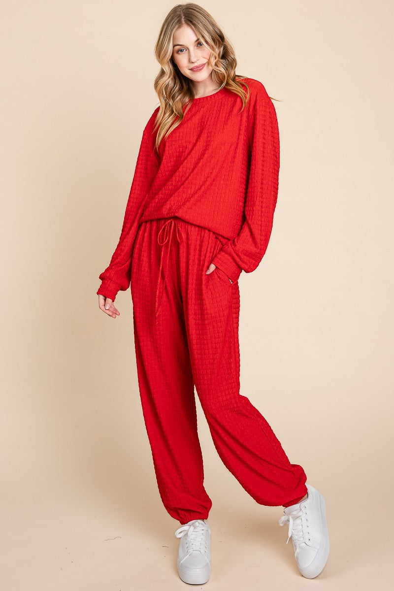 Red full-size crinkle check round neck top and pants lounge set with drawstring, made of polyester and spandex, slightly stretchy.