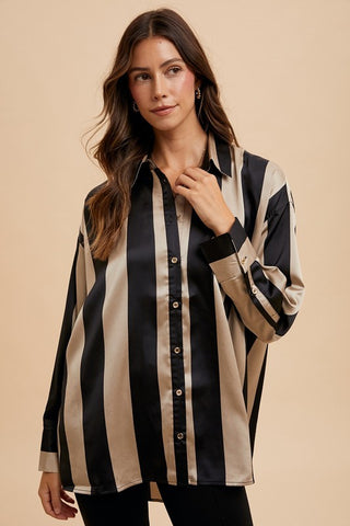 Striped dropped shoulder button-up shirt in black and beige polyester, featuring a basic style with long sleeves and no stretch.