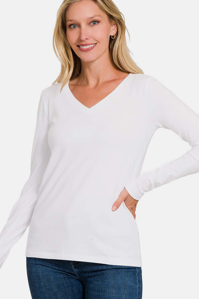 White full size V-neck long sleeve T-shirt with slight stretch, made from cotton and spandex, modeled by woman smiling.