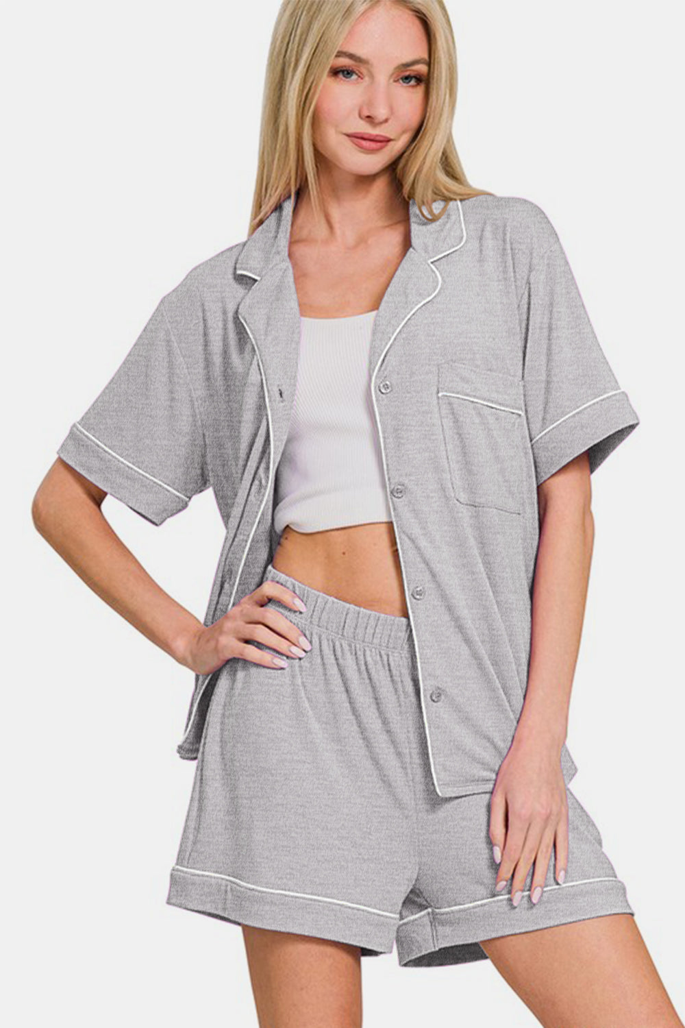 Light gray button down short sleeve lounge set with shorts, featuring pockets and slightly stretchy fabric for comfort.