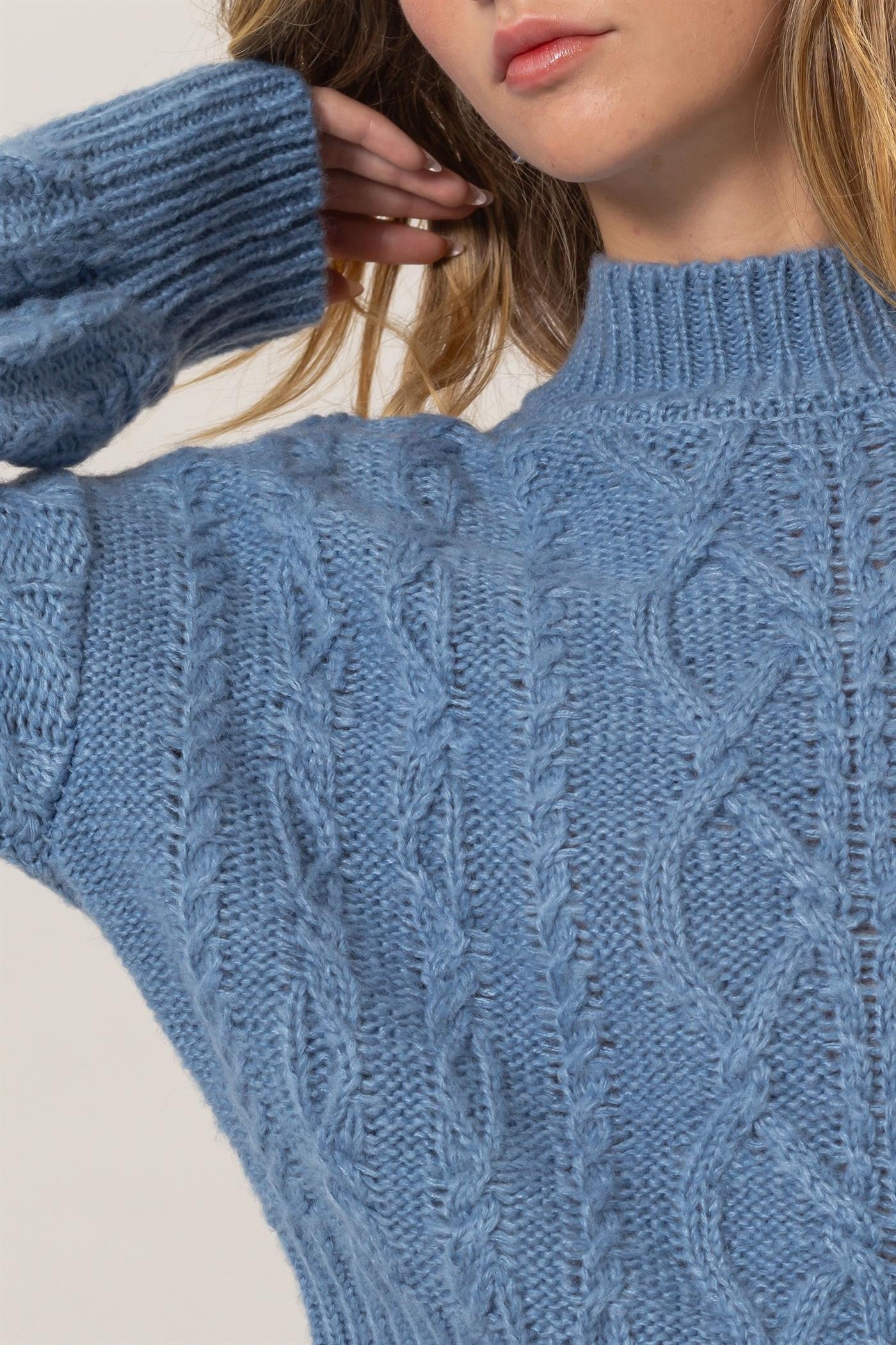 Gray blue cable-knit sweater with mock neck and dropped shoulders, featuring ribbed detail and slightly stretchy acrylic-nylon blend.