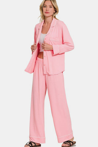 Pink button-down long sleeve top and pants lounge set with pockets, featuring slightly stretchy fabric made of polyester, rayon, and spandex.