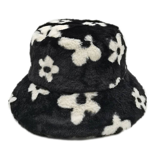 Floral printed faux fur bucket hat with black and white design, flat top, cozy winter style, adjustable strings, made of 100% polyester.