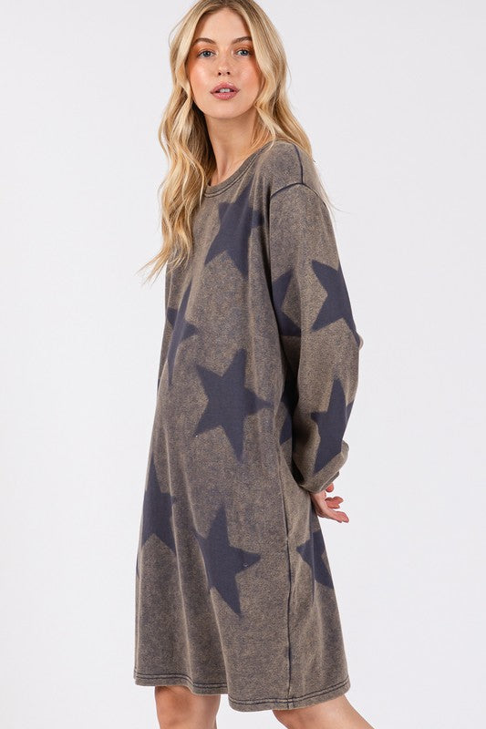 Woman wearing dark gray round neck dress with star print, made of 100% cotton, slightly stretchy and opaque.