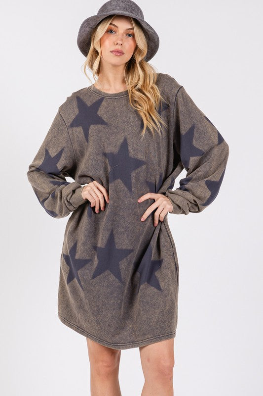 Woman wearing dark gray washed star print round neck dress made of 100% cotton, slightly stretchy, with long sleeves and a casual fit.