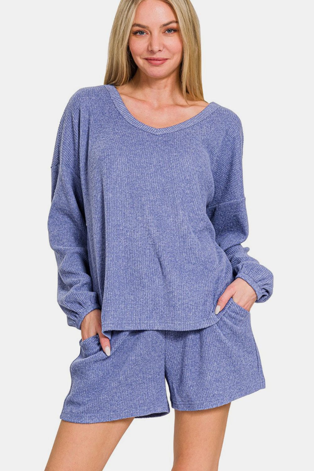 Zenana V-Neck Long Sleeve Ribbed Top and Shorts Set in blue, featuring a stylish and comfortable casual design perfect for chic relaxation.