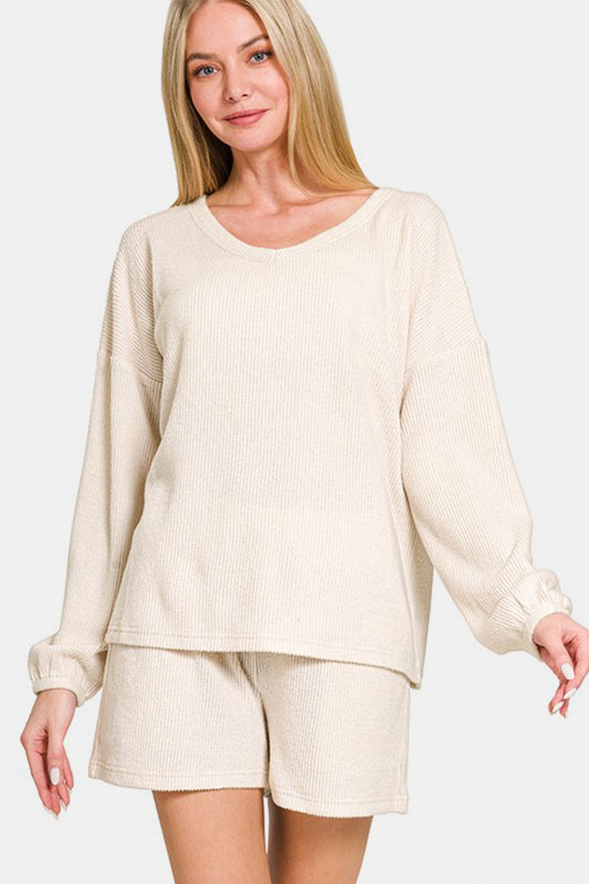 Beige V-neck long sleeve ribbed top and shorts set, two-piece outfit made of polyester, rayon, and spandex with slight stretch.