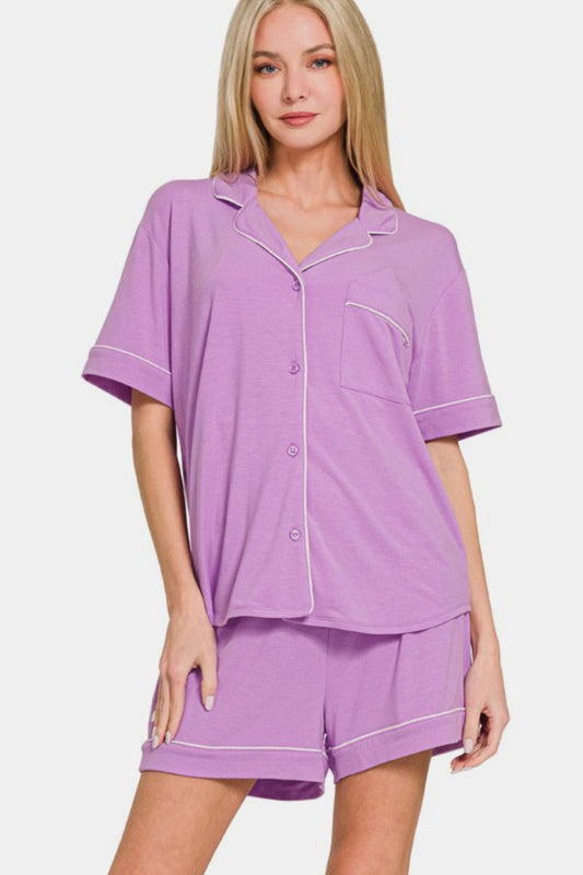 Purple button down short sleeve top and shorts lounge set with pocket detail, slightly stretchy fabric, two-piece outfit.