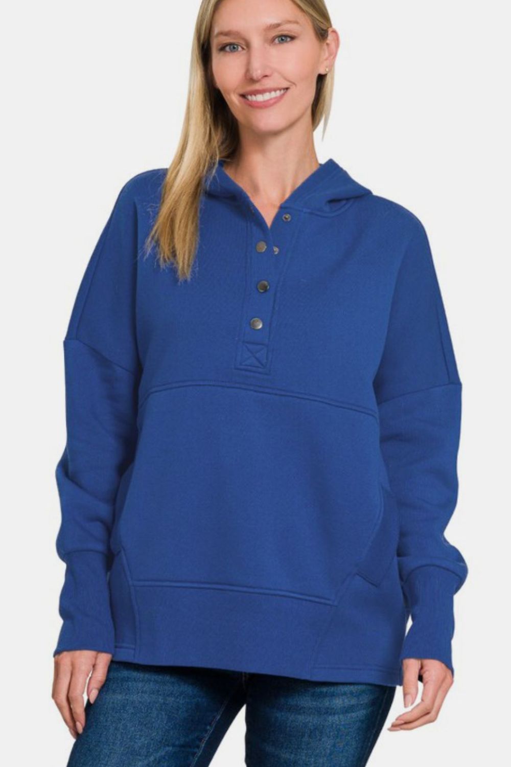 Woman wearing navy half snap long sleeve hoodie with kangaroo pocket, made of 60% cotton and 40% polyester, ribbed design