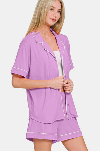 Purple button-down short sleeve top and shorts lounge set with pockets, slightly stretchy, made from polyester, rayon, and spandex.