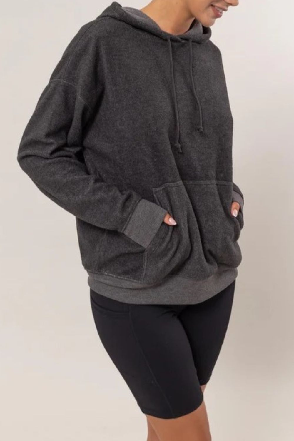 Charcoal brushed long sleeve hoodie with drawstring and kangaroo pocket, made of 60% polyester and 40% rayon, slightly stretchy material.