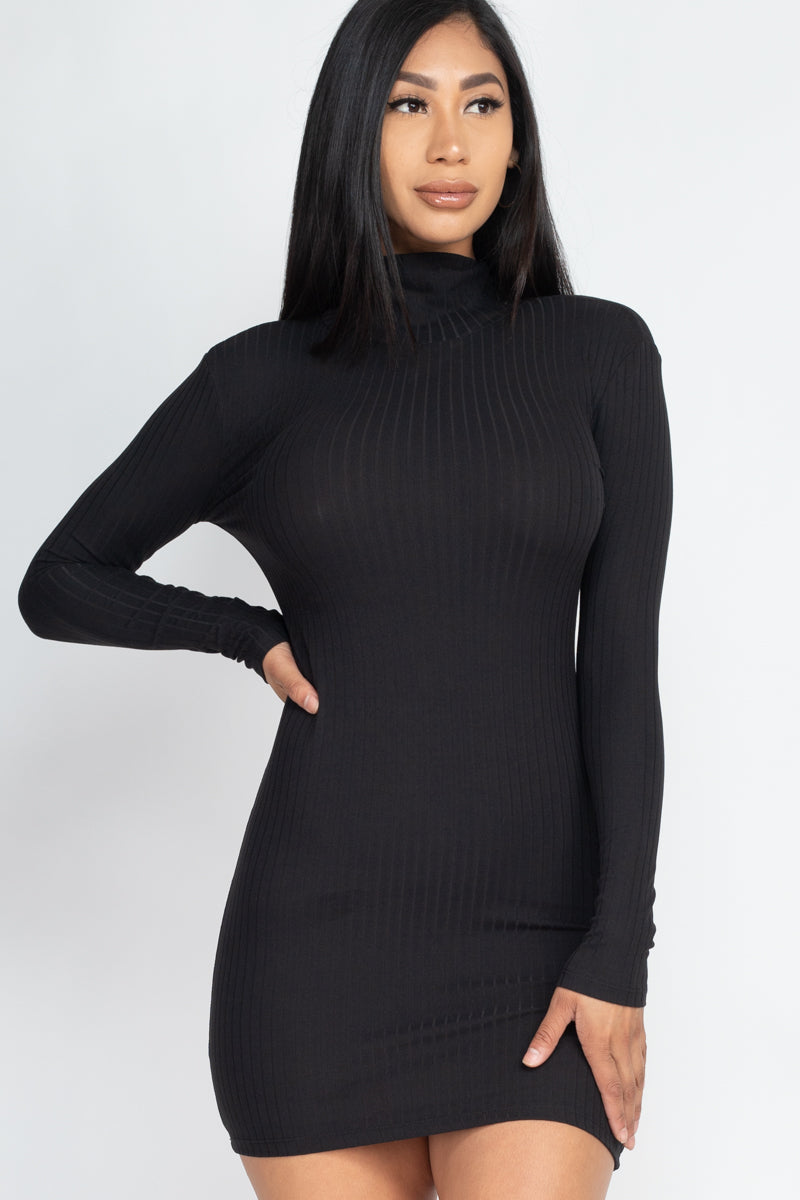 Model wearing a black ribbed mock neck bodycon mini dress with long sleeves, showcasing a sleek and stylish silhouette. 92% Polyester, 8% Spandex.