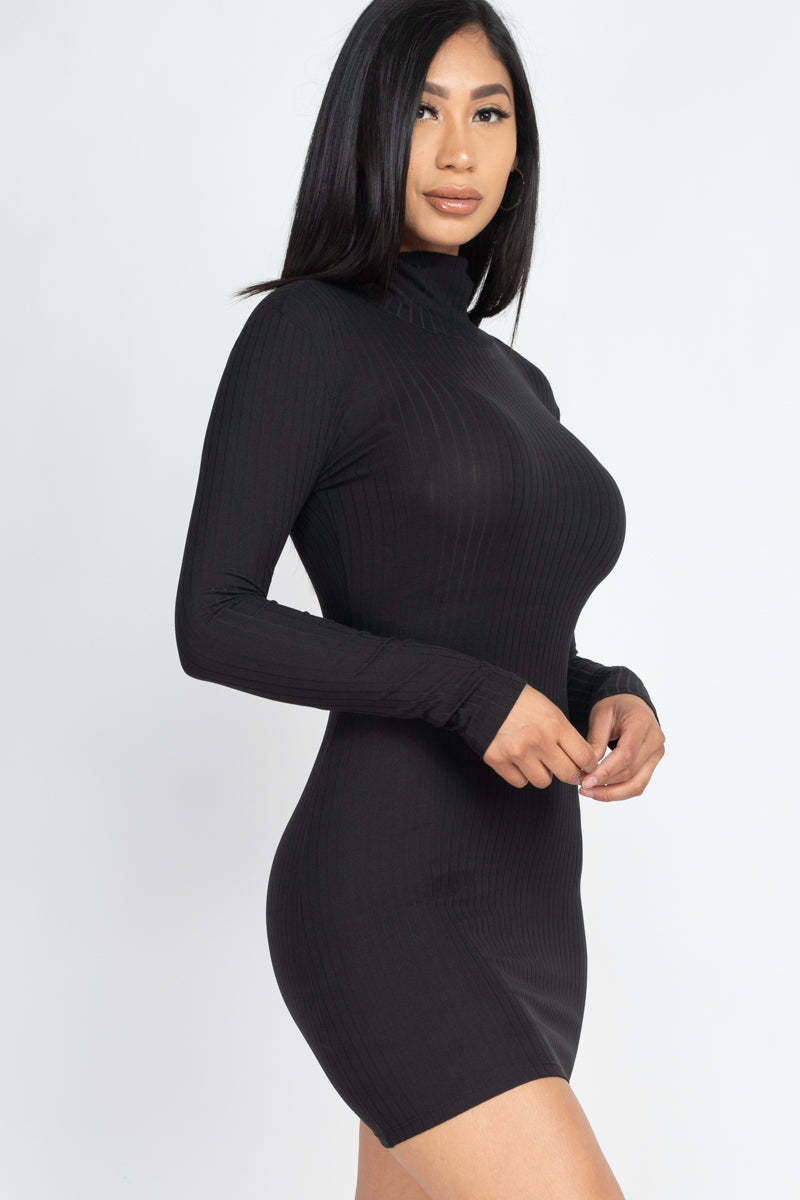 Woman wearing a black ribbed mock neck bodycon mini dress, long sleeves, high stretch knit fabric. Fashionable and stylish outfit.