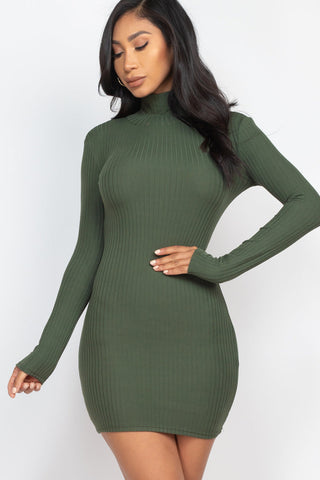 Model wearing green ribbed mock neck bodycon mini dress, showcasing long sleeves and form-fitting design with soft, stretchy fabric.