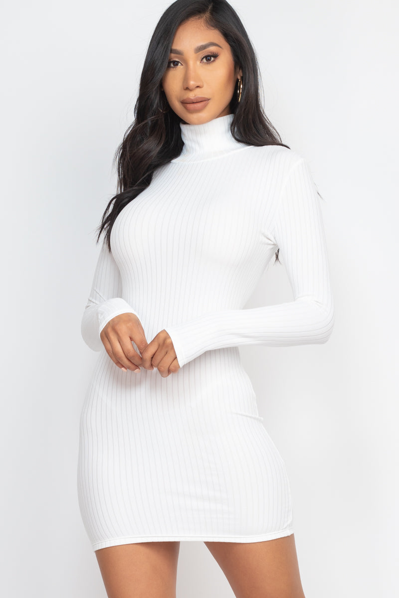 Woman wearing white ribbed mock neck bodycon mini dress, showcasing stretchy knit fabric and stylish design.