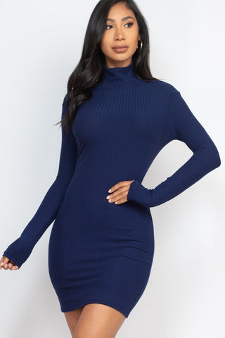 Woman wearing ribbed mock neck bodycon mini dress in navy blue with long sleeves, showcasing a stylish and stretchy fit.