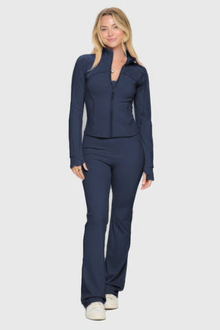 Woman wearing premium yoga jacket with thumbhole sleeves and flare-bottom jumpsuit, coordinating chic look for workouts and casual outings.