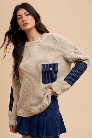 Khaki contrast round neck drop shoulder sweater with blue patch pocket, featuring exposed seams, slightly stretchy polyester material.