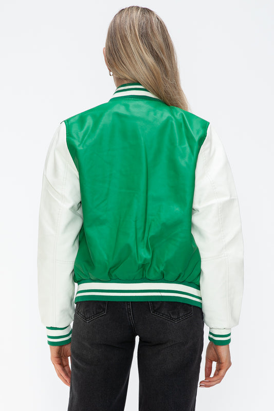 Woman wearing a green and white PU leather bomber jacket, featuring a contrast snap-down design, viewed from the back.