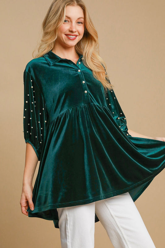 Hunter green velvet blouse with pearl detail, buttoned half sleeves, and high-low design.