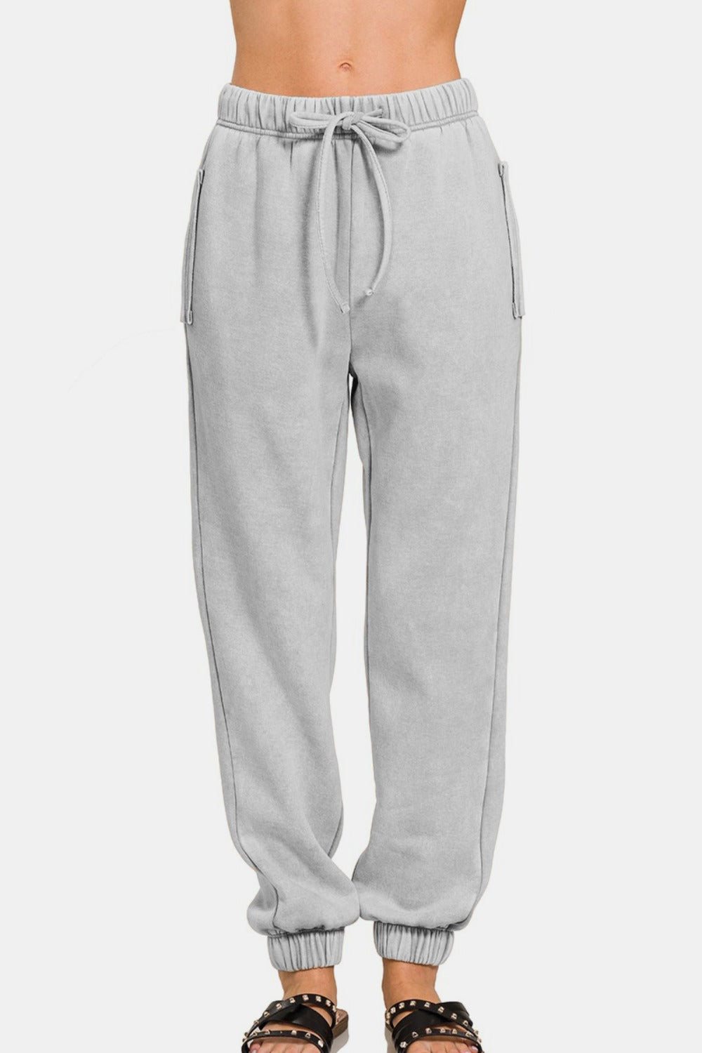 Zenana acid wash fleece drawstring sweatpants with pockets showcasing comfortable fit and stylish design.