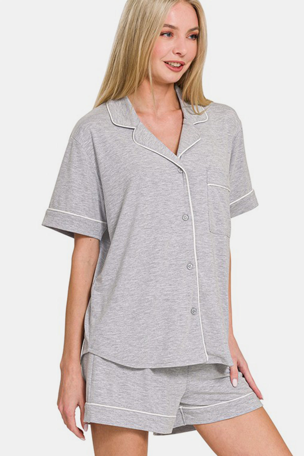 Light gray button-down lounge set with short sleeves and shorts, featuring pockets and slight stretch, made from polyester blend.